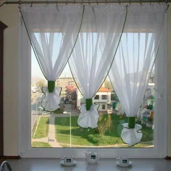 Tulle curtains for the kitchen up to the windowsill photo
