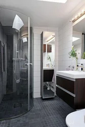 Photo of black and white bathtubs with showers