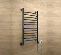 Electric Heated Towel Rail In The Bathroom Interior Photo