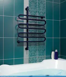 Electric Heated Towel Rail In The Bathroom Interior Photo