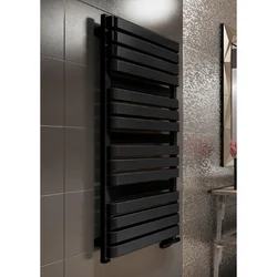 Electric heated towel rail in the bathroom interior photo
