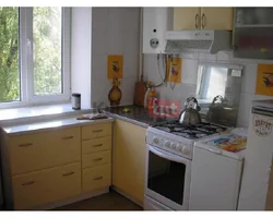 Kitchens with gas stove design photo of a small area