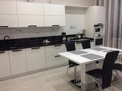 Kitchen with black table photo