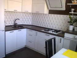 Countertops and wall panels for white kitchen photo