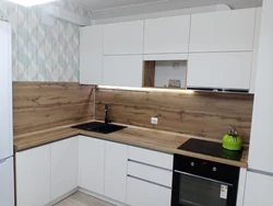 Countertops and wall panels for white kitchen photo