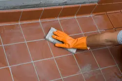 Grouting Tiles In The Bathroom Photo