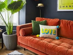Orange sofa in the living room interior
