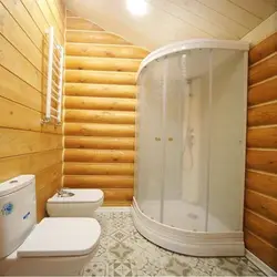 Bathroom design in a wooden house with shower