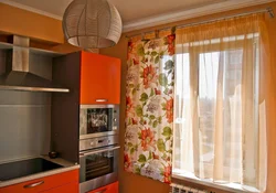 Hanging curtains in the kitchen photo