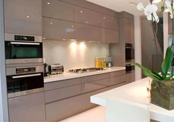 Beige kitchen design with black splashback