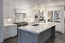 Kitchens with marble countertops and apron photo in the interior