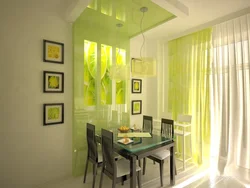 White kitchen interior with green curtains
