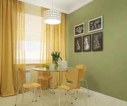 White kitchen interior with green curtains