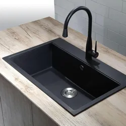 Dark kitchen sink photo