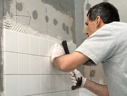 How to properly lay tiles on a wall in a bathroom photo
