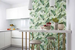 Wallpaper with leaves in the kitchen interior