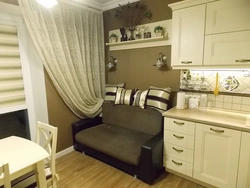 Interior of a small kitchen with a sofa photo