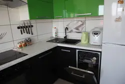 Corner kitchen design with refrigerator and dishwasher