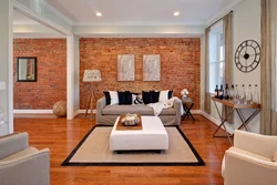 Design of a brick wall in the interior of the living room photo