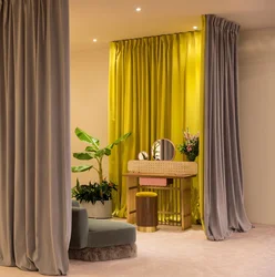 Yellow curtains in the bedroom interior photo