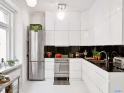 Interior design of kitchen with white refrigerator