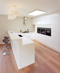 White kitchen design with breakfast bar