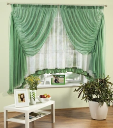 Emerald curtains in the kitchen interior