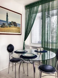 Emerald curtains in the kitchen interior