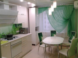 Emerald curtains in the kitchen interior