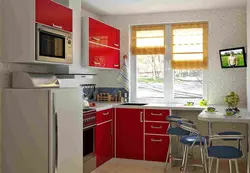 Corner kitchen design with refrigerator and window