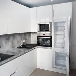 White Kitchen Design With Black Appliances