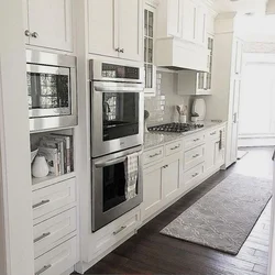 White Kitchen Design With Black Appliances