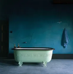 Cast iron bathtub in the bathroom interior