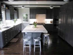 Dark Floors And Light Walls In The Kitchen Interior