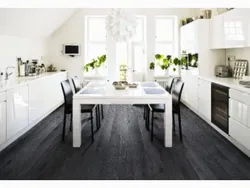 Dark floors and light walls in the kitchen interior