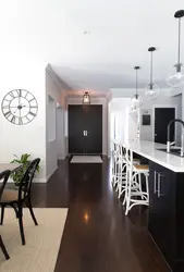 Dark floors and light walls in the kitchen interior