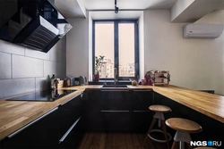 Photo of a kitchen with a loft style window