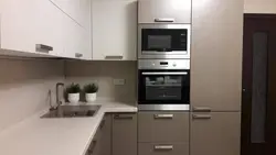 Kitchen with gray refrigerator photo