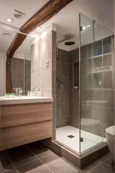 Photo Of A Bathroom With A Toilet And A Shower Corner
