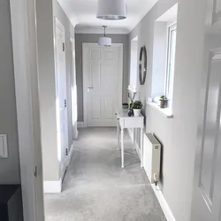 Photo of a hallway with a gray door