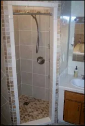 Photo Of A Tiled Shower In A Small Bathroom