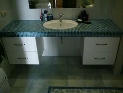 Tile Countertop In The Bathroom Under The Sink Photo