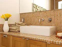 Tile Countertop In The Bathroom Under The Sink Photo