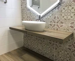 Tile countertop in the bathroom under the sink photo