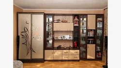 Wall in the living room with a wardrobe for clothes and linen photo