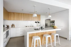 Corner white kitchen with wooden countertop photo in the interior