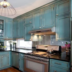 Blue-green kitchen in the interior