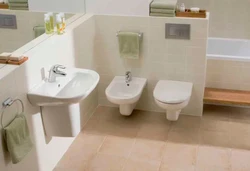 Photo Of Bidet And Toilet In The Bathroom