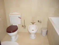 Photo Of Bidet And Toilet In The Bathroom