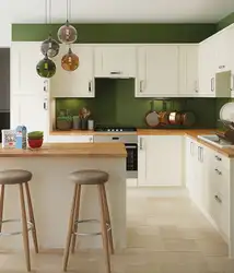 Green kitchens with beige interior photo